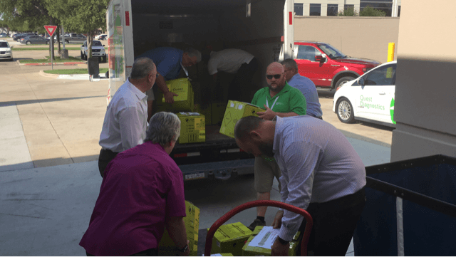 Employees at our Irving, Texas, laboratory unload specimens transferred from our Houston lab ahead of Tropical Storm Harvey.